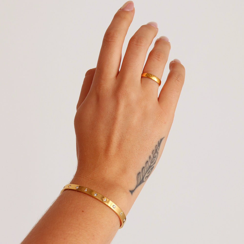 Bracciale rigido con pietra stellata incastonata - Oro